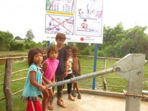 Girls pumping at a well